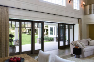 Expansive sliding patio doors leading to the back yard