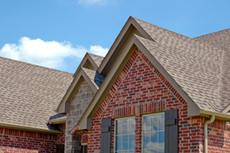 Asphalt shingle roofing on a brick home