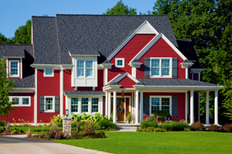 Red siding on a two-story family home